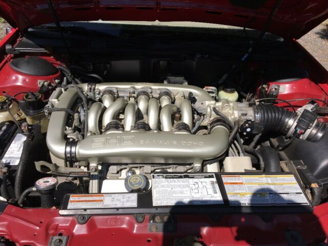 1994 Red Ford Taurus Sedan