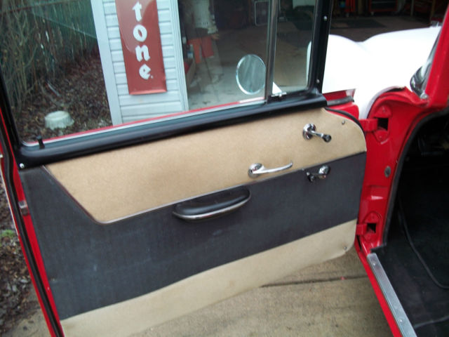 1956 red and white Chevrolet Bel Air/150/210 Sedan