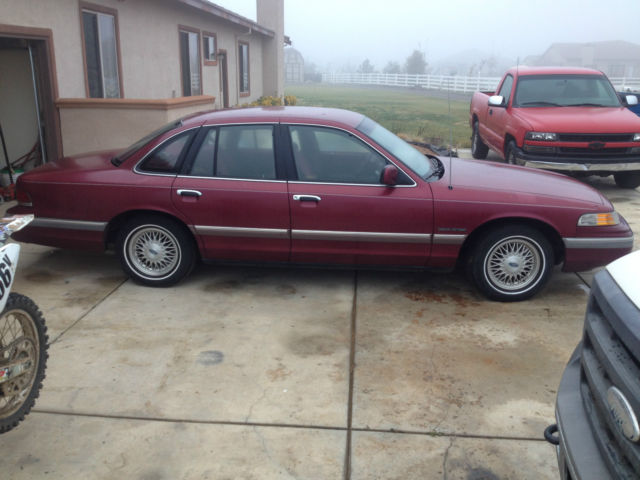 1992 red ish Ford Crown Victoria 4door