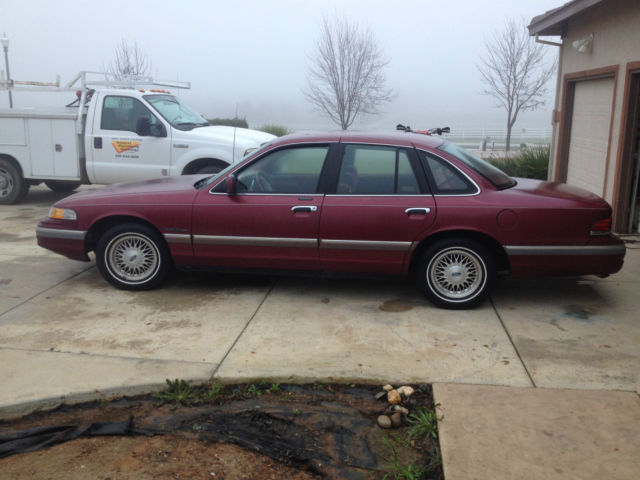 1992 red ish Ford Crown Victoria 4door
