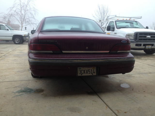 1992 red ish Ford Crown Victoria 4door
