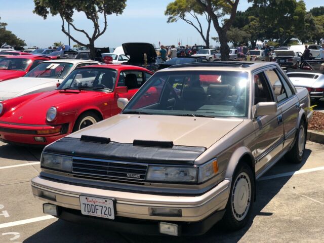 1987 Gold Nissan Maxima 4 door sports car