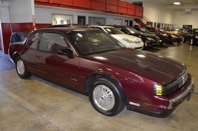 1988 Burgundy Oldsmobile Toronado Coupe