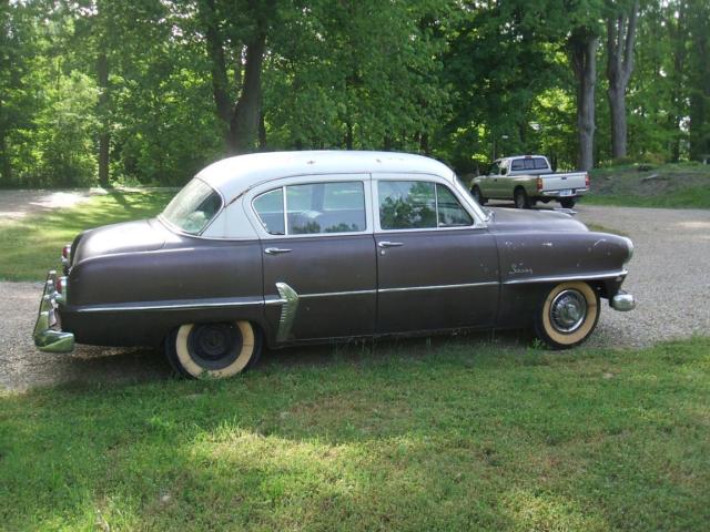 1954 White over Brown Plymouth Savoy Sedan