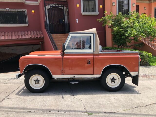 1972 Orange Land Rover Defender Wagon