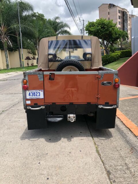 1972 Orange Land Rover Defender Wagon