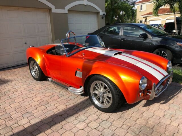 1965 Metallic orange Ford Cobra
