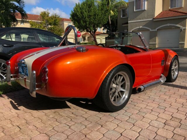 1965 Metallic orange Ford Cobra
