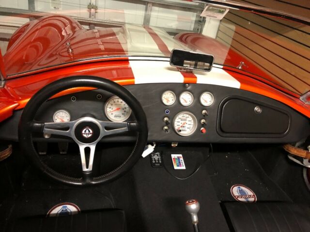 1965 Metallic orange Ford Cobra
