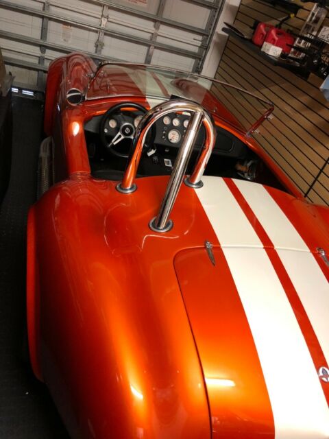 1965 Metallic orange Ford Cobra
