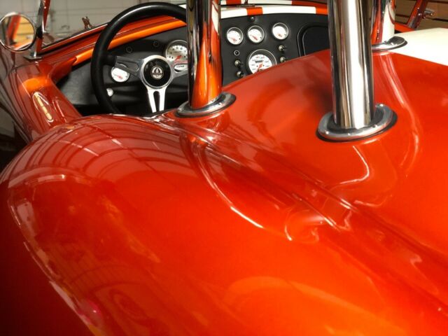 1965 Metallic orange Ford Cobra