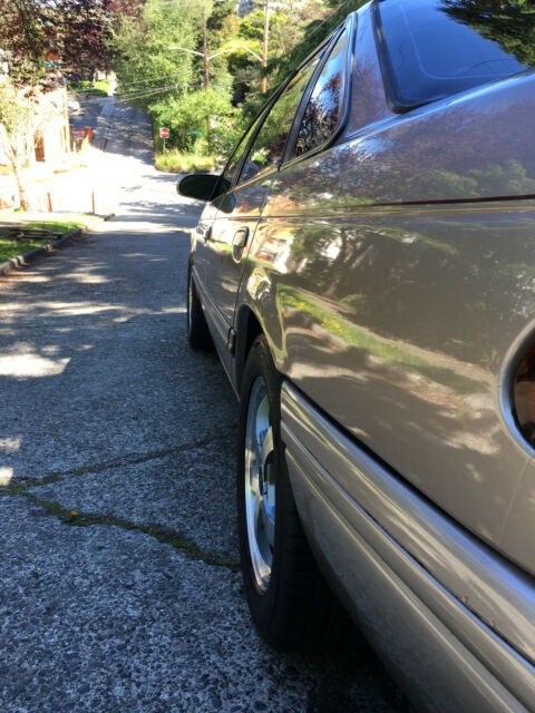 1994 Champagne Beige Ford Taurus Sedan