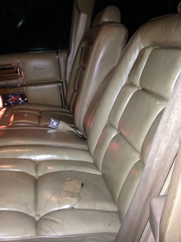 19820000 yellow Cadillac Brougham 4 door