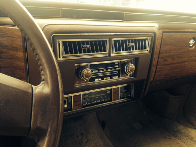 19820000 yellow Cadillac Brougham 4 door