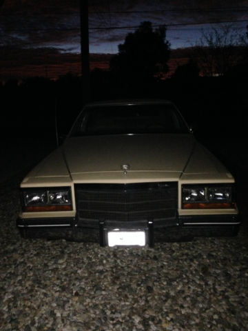 19820000 yellow Cadillac Brougham 4 door