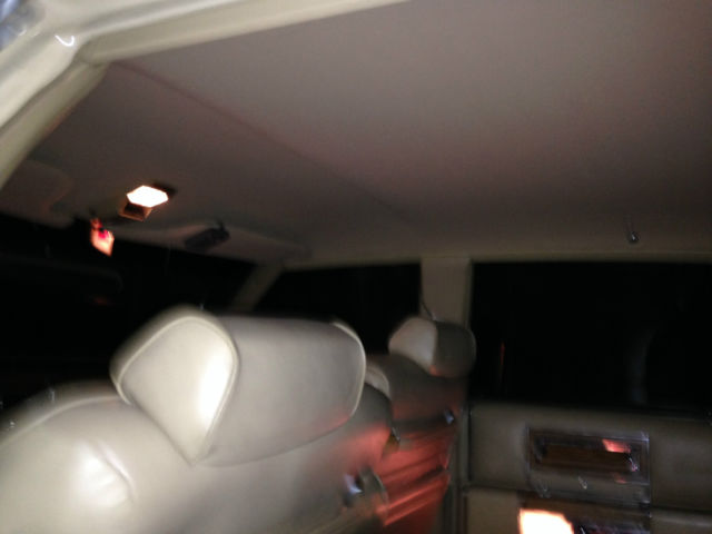 1982 yellow Cadillac Brougham 4 door