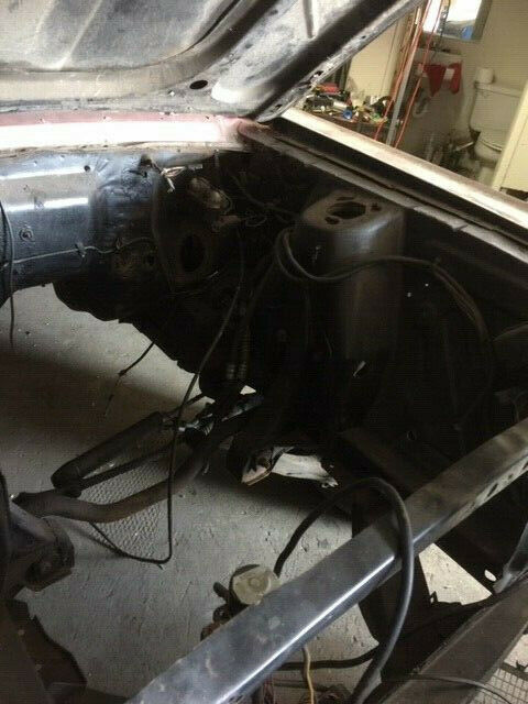 1968 primer red Ford Mustang Coupe