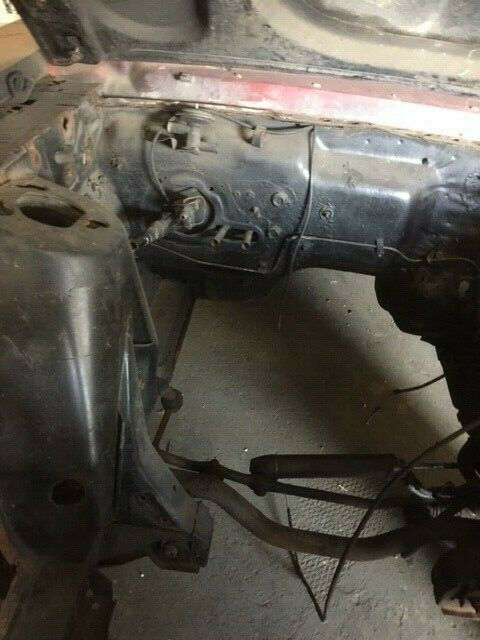 1968 primer red Ford Mustang Coupe