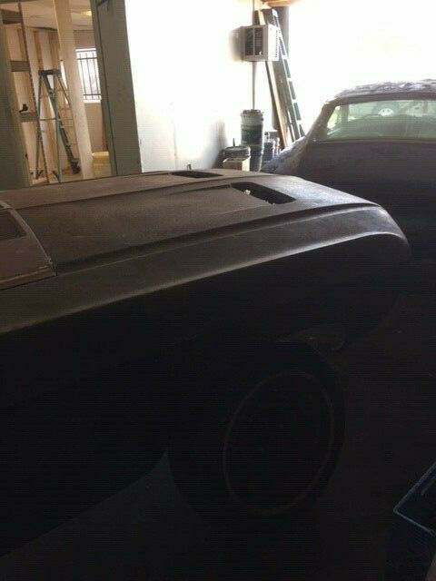 1968 primer red Ford Mustang Coupe