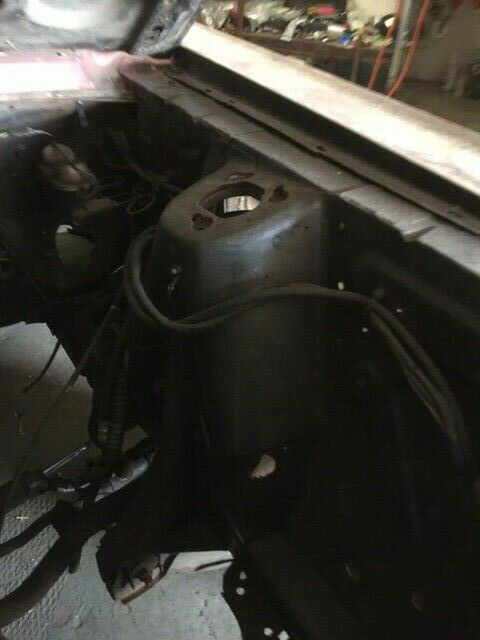 1968 primer red Ford Mustang Coupe