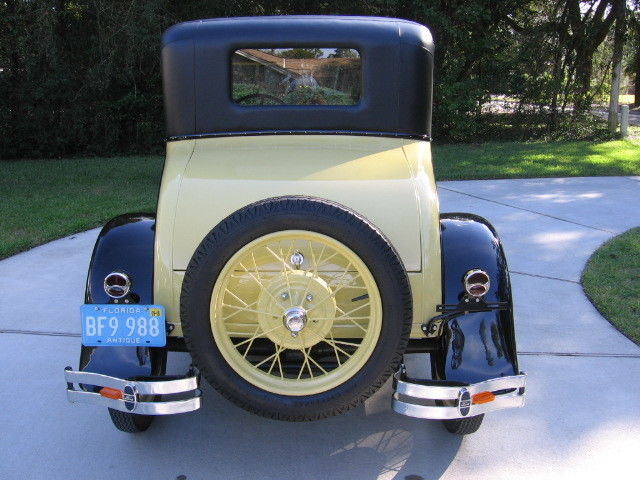 1928 Yellow Ford Model A Coupe