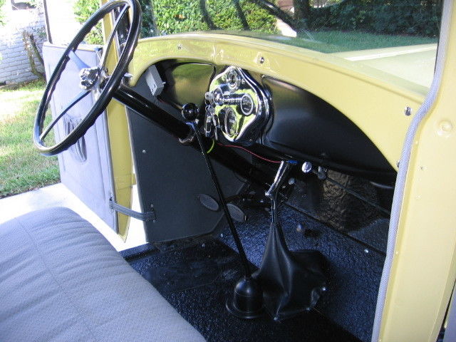 1928 Yellow Ford Model A Coupe