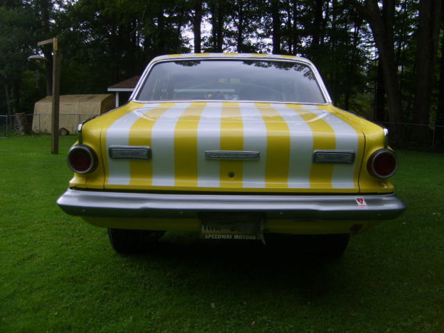 1964 yellow with ram charger stripes Dodge Dart 2 door sedan