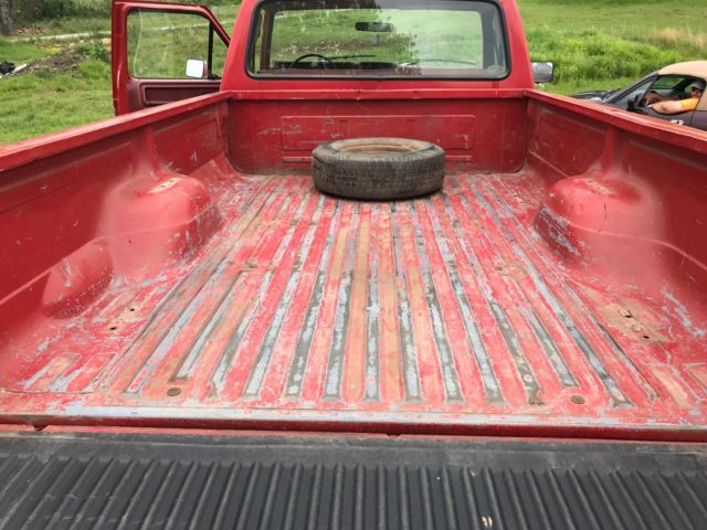 1986 Red and White Ford F-150 Standard Cab Pickup