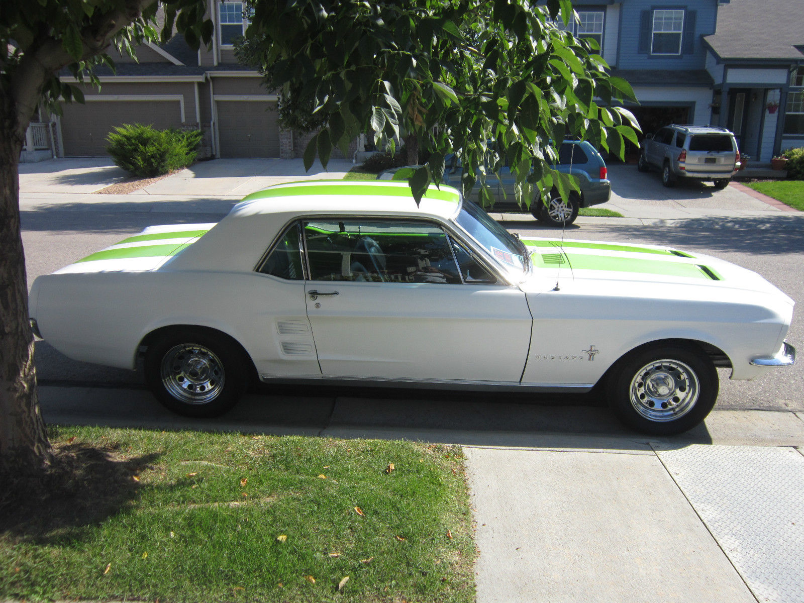 1967 white with green racing stripes Ford Mustang Coupe