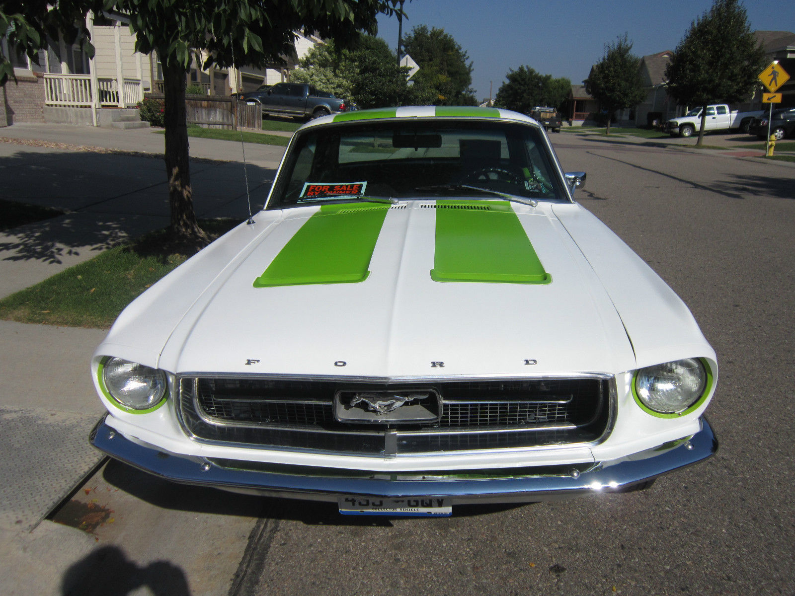 1967 white with green racing stripes Ford Mustang Coupe