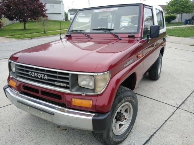 1990 Red Toyota Land Cruiser SUV