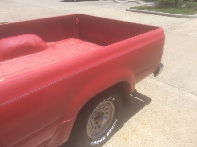 1990 Red Toyota Tacoma Extended Cab Pickup