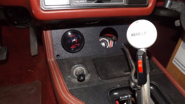 1984 flat black Ford Mustang Coupe