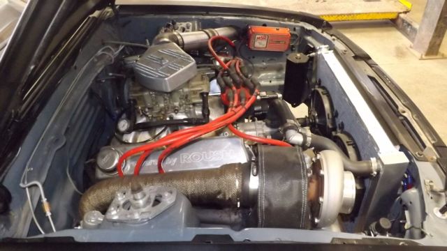 1984 flat black Ford Mustang Coupe