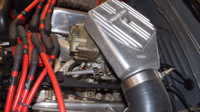 1984 flat black Ford Mustang Coupe