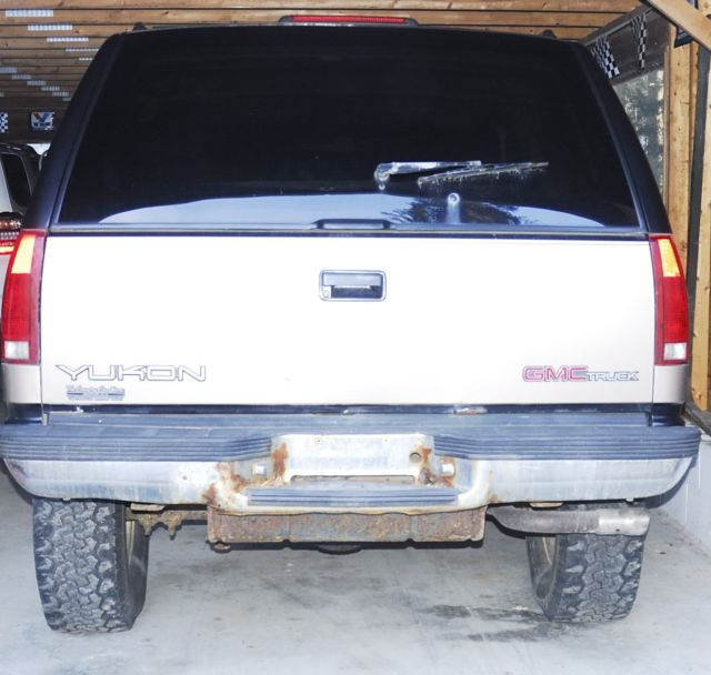 1994 tan/black GMC Yukon 2 door