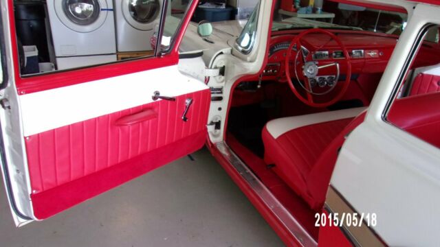 1957 red and white Ford Fairlane Coupe