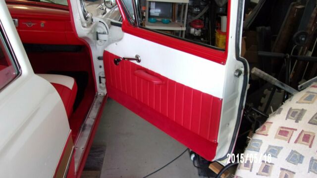 1957 red and white Ford Fairlane Coupe