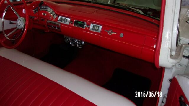 1957 red and white Ford Fairlane Coupe