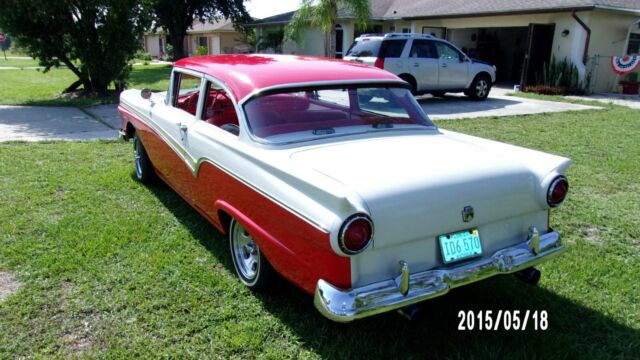 1957 red and white Ford Fairlane Coupe
