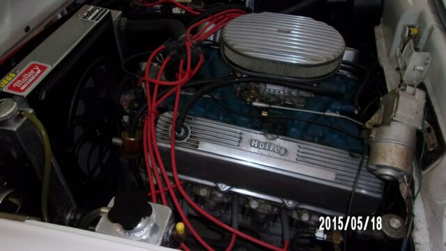 1957 red and white Ford Fairlane Coupe