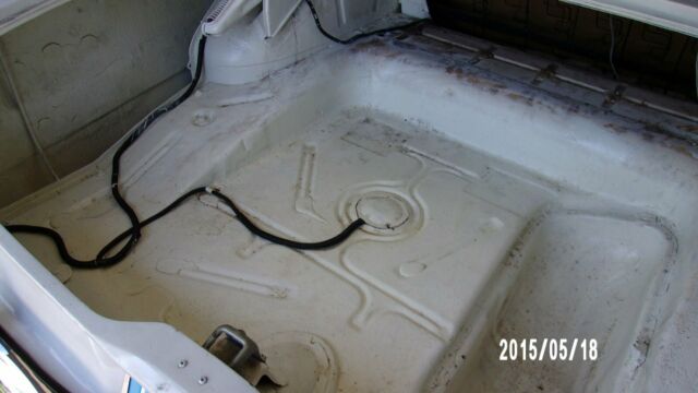 1957 red and white Ford Fairlane Coupe