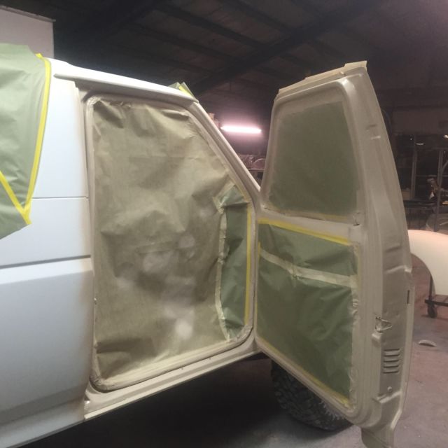 1993 tan bedlined Ford Bronco Convertible