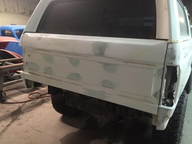 1993 tan bedlined Ford Bronco Convertible