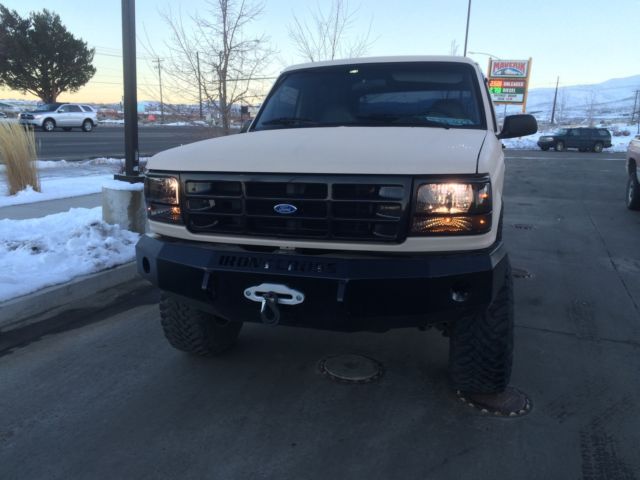 1993 tan bedlined Ford Bronco Convertible
