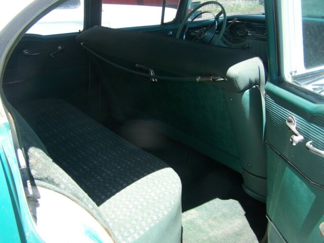 1956 green/white Oldsmobile Eighty-Eight four door sedan