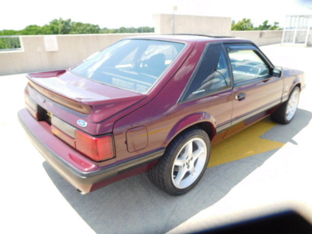 1989 Burgundy Ford Mustang Hatchback