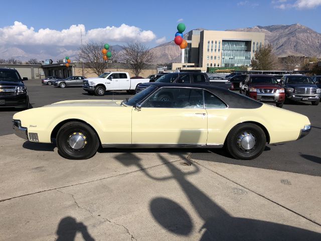 1967 Yellow Oldsmobile Toronado --