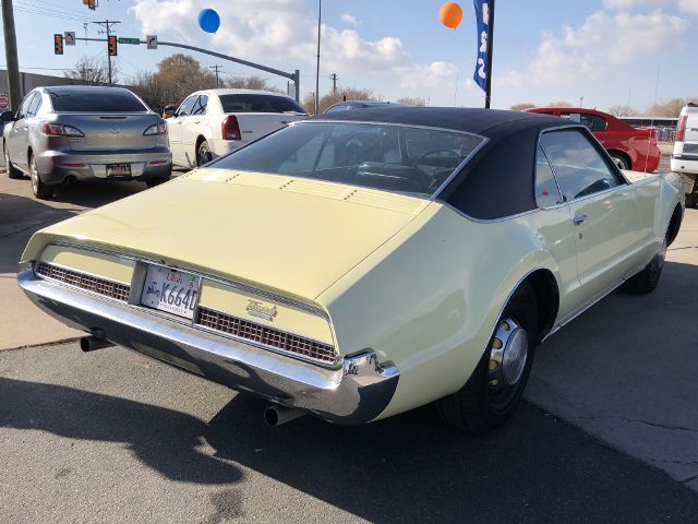1967 Yellow Oldsmobile Toronado --