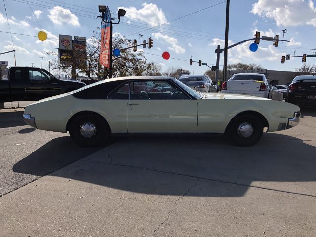 1967 Yellow Oldsmobile Toronado --